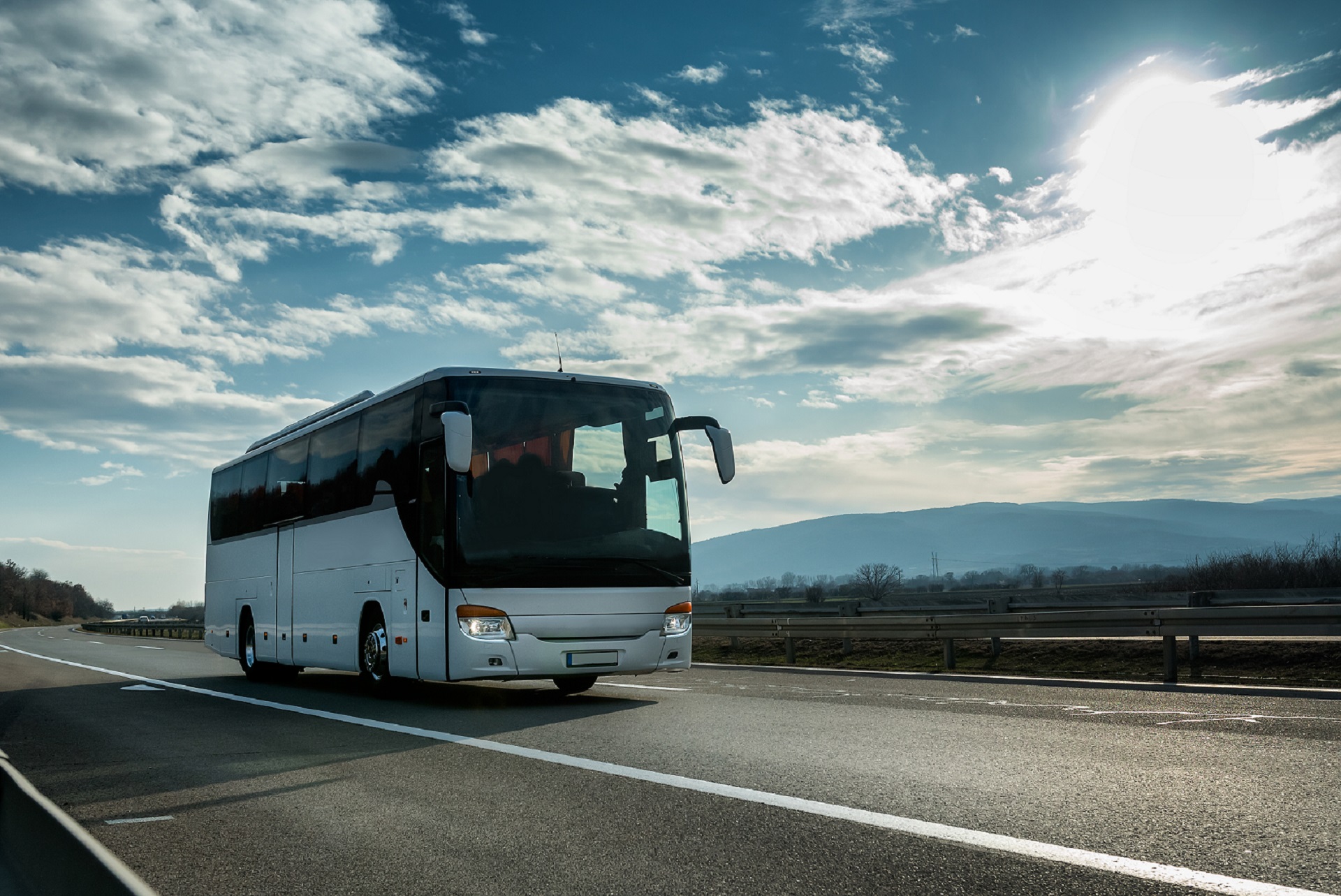 White,Modern,Comfortable,Tourist,Bus,Driving,Through,Highway,At,Bright